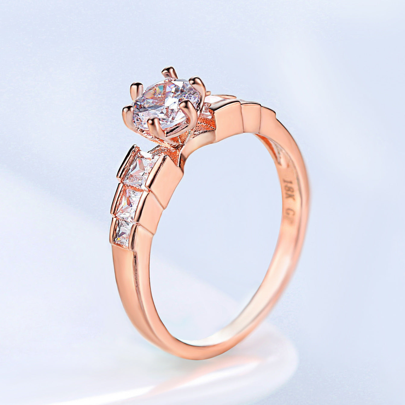 Rosé-Goldring mit geometrischem Stein