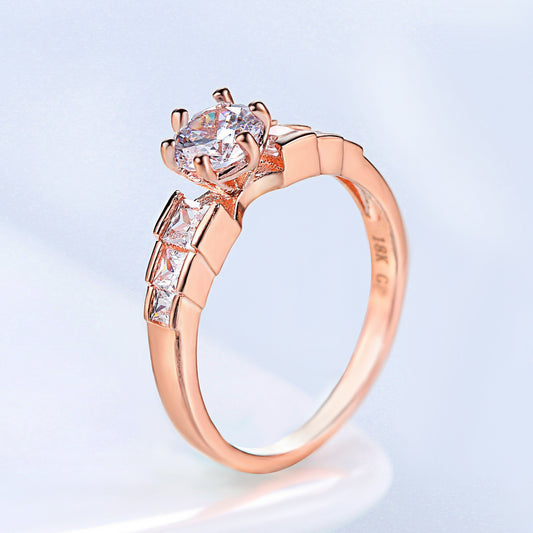 Rosé-Goldring mit geometrischem Stein
